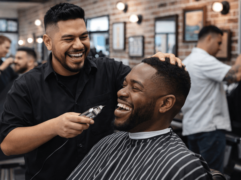 Barber cutting a client's hair in a modern barbershop